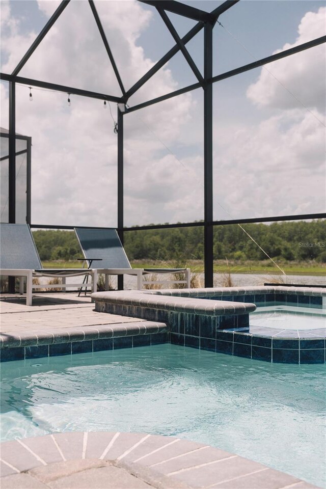4161 Paragraph Dr, Kissimmee, FL 34746 - outdoor pool featuring a lanai