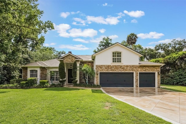 1874 Royal Majesty Ct, Oviedo, FL 32765 - view of front of property featuring stone siding, a front yard, concrete driveway, stucco siding, and an attached garage