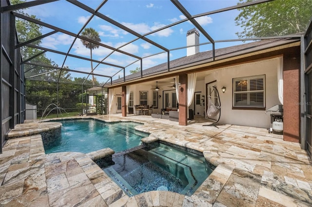 1874 Royal Majesty Ct, Oviedo, FL 32765 - view of swimming pool with a ceiling fan, a pool with connected hot tub, a patio area, and glass enclosure