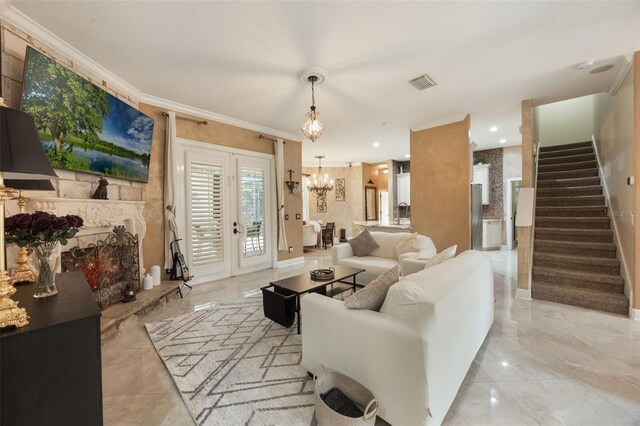 1874 Royal Majesty Ct, Oviedo, FL 32765 - living area featuring crown molding, a chandelier, and stairs