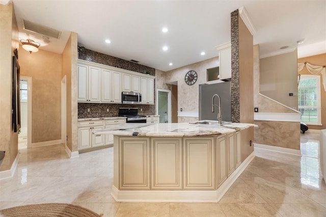 1874 Royal Majesty Ct, Oviedo, FL 32765 - kitchen with stainless steel appliances, a sink, light stone counters, baseboards, and recessed lighting