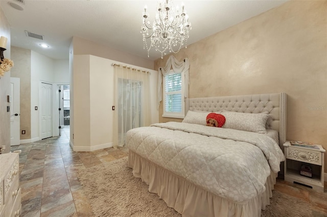 1874 Royal Majesty Ct, Oviedo, FL 32765 - bedroom featuring a chandelier, baseboards, and light stone finish flooring