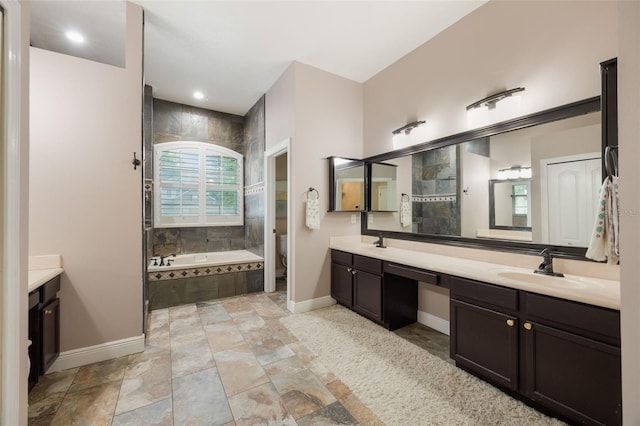 1874 Royal Majesty Ct, Oviedo, FL 32765 - bathroom with double vanity, baseboards, a bath, and tiled shower