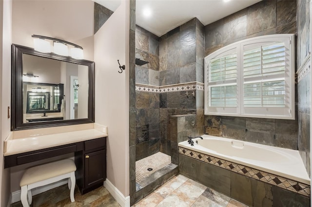1874 Royal Majesty Ct, Oviedo, FL 32765 - bathroom with a bath, a walk in shower, vanity, and baseboards
