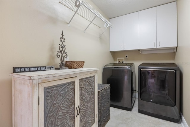 1874 Royal Majesty Ct, Oviedo, FL 32765 - washroom featuring separate washer and dryer, cabinet space, and light tile patterned floors