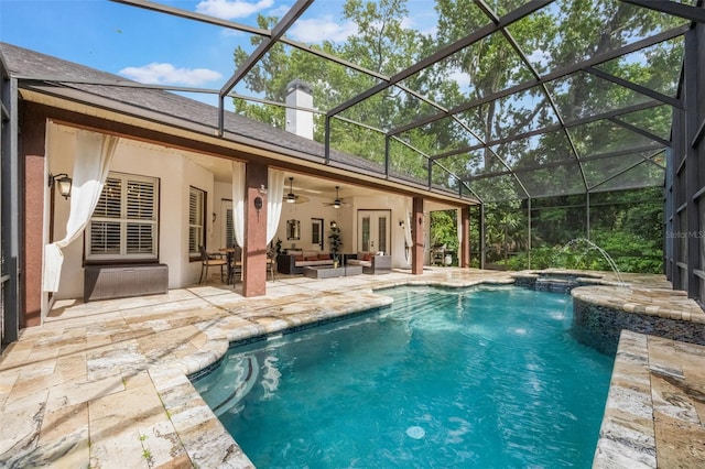 1874 Royal Majesty Ct, Oviedo, FL 32765 - rear view of house with a ceiling fan, an outdoor hangout area, a patio area, a pool with connected hot tub, and stucco siding