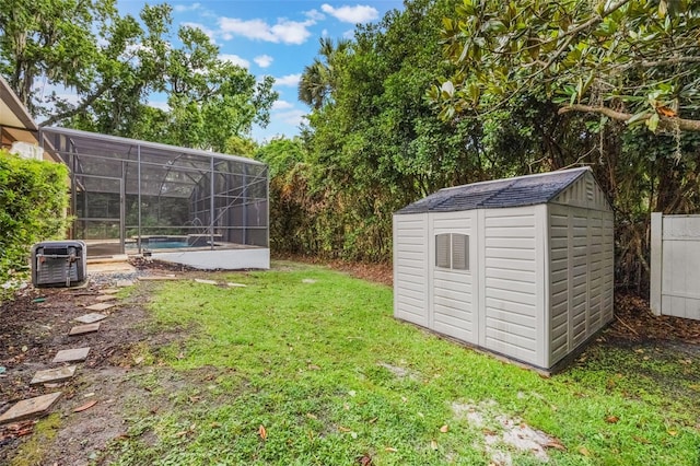 1874 Royal Majesty Ct, Oviedo, FL 32765 - view of grassy yard featuring central AC unit, a swimming pool, and a lanai