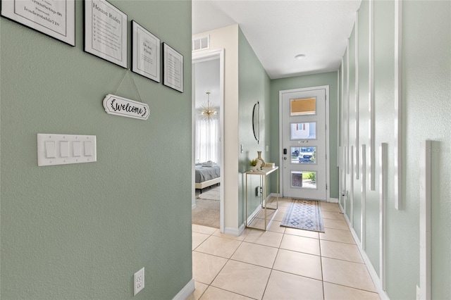 1809 Tropical Palms Cir, Kissimmee, FL 34747 - entrance foyer with light tile patterned floors and baseboards