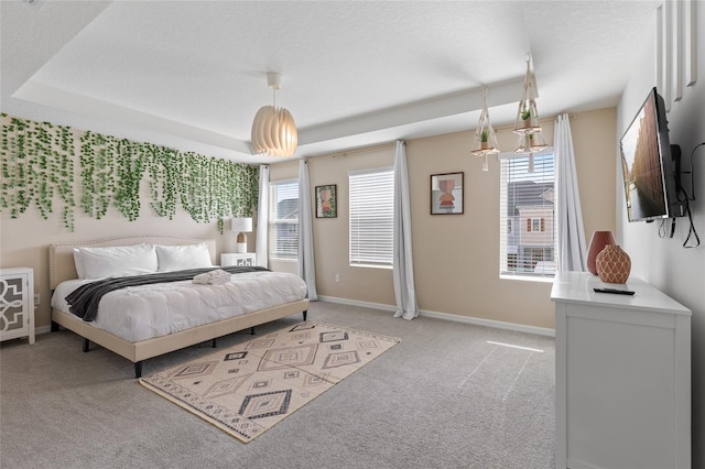 1809 Tropical Palms Cir, Kissimmee, FL 34747 - bedroom with light colored carpet, multiple windows, and a textured ceiling