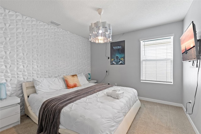 1809 Tropical Palms Cir, Kissimmee, FL 34747 - bedroom with a chandelier, a textured ceiling, and carpet floors