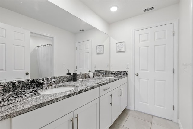 1809 Tropical Palms Cir, Kissimmee, FL 34747 - full bathroom featuring double vanity and tile patterned floors