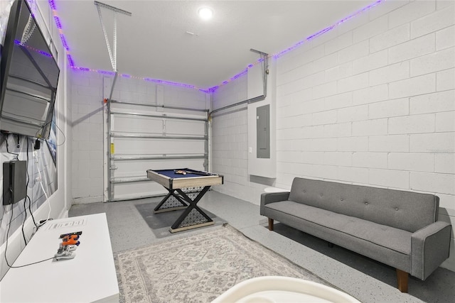 1809 Tropical Palms Cir, Kissimmee, FL 34747 - playroom with a garage, electric panel, concrete block wall, and speckled floor
