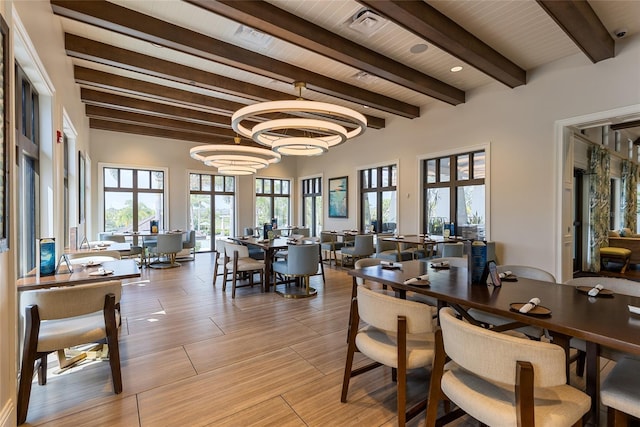1809 Tropical Palms Cir, Kissimmee, FL 34747 - dining area with beam ceiling and a chandelier