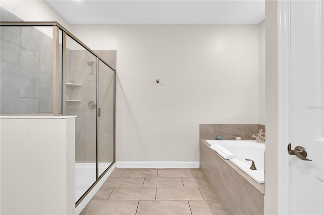 4530 Narrative Ln, Kissimmee, FL 34746 - full bath featuring a shower stall, a bath, tile patterned flooring, and baseboards
