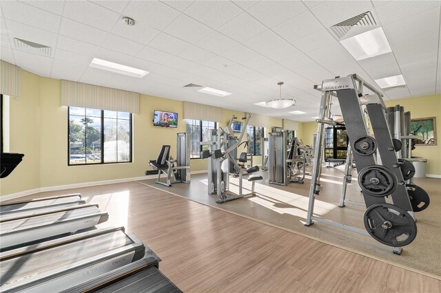 4530 Narrative Ln, Kissimmee, FL 34746 - workout area with wood finished floors, baseboards, and a drop ceiling