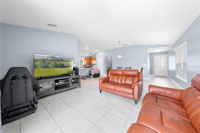 236 Miles Ct, Davenport, FL 33837 - living room with lofted ceiling, light tile patterned floors, and recessed lighting