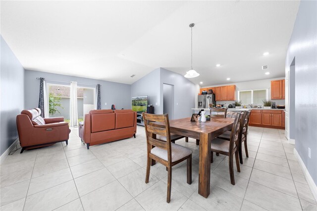 236 Miles Ct, Davenport, FL 33837 - dining area with baseboards, recessed lighting, plenty of natural light, light tile patterned flooring, and vaulted ceiling