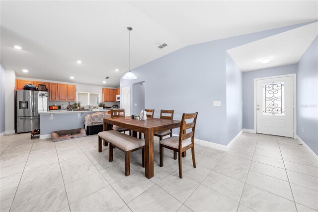 236 Miles Ct, Davenport, FL 33837 - dining room with baseboards, recessed lighting, light tile patterned flooring, and vaulted ceiling