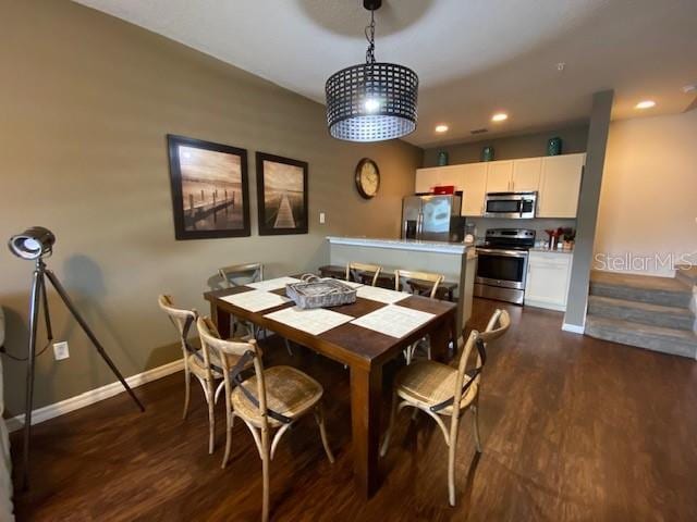 5370 Diplomat Ct Unit 107, Kissimmee, FL 34746 - dining area featuring dark wood-type flooring, baseboards, and recessed lighting