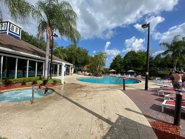 5370 Diplomat Ct Unit 107, Kissimmee, FL 34746 - community pool with a patio area