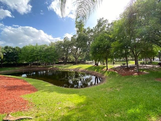 5370 Diplomat Ct Unit 107, Kissimmee, FL 34746 - view of community with a lawn and a water view