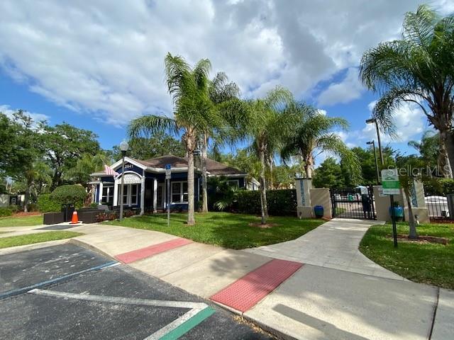 5370 Diplomat Ct Unit 107, Kissimmee, FL 34746 - surrounding community featuring a gate and uncovered parking