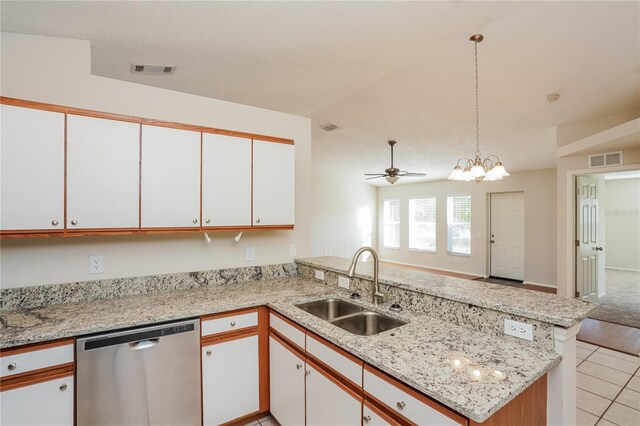 11212 3rd Ave E, Bradenton, FL 34212 - kitchen featuring dishwasher, a sink, a peninsula, and white cabinets