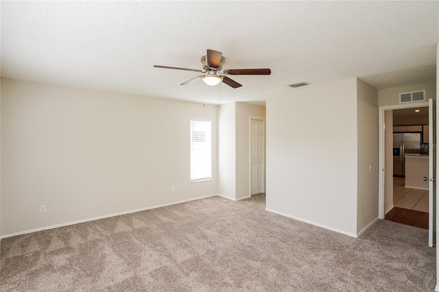 11212 3rd Ave E, Bradenton, FL 34212 - carpeted empty room featuring a ceiling fan, baseboards, and a textured ceiling
