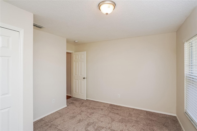 11212 3rd Ave E, Bradenton, FL 34212 - carpeted empty room featuring a textured ceiling and baseboards