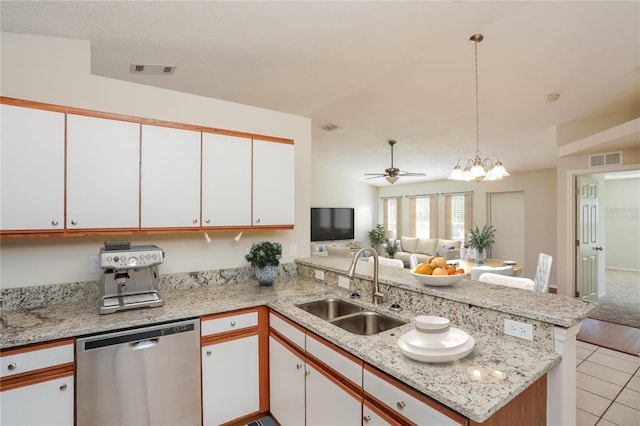 11212 3rd Ave E, Bradenton, FL 34212 - kitchen featuring dishwasher, a sink, a peninsula, open floor plan, and white cabinetry