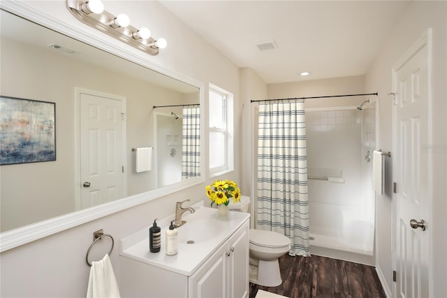 11212 3rd Ave E, Bradenton, FL 34212 - bathroom featuring vanity, wood finished floors, and toilet