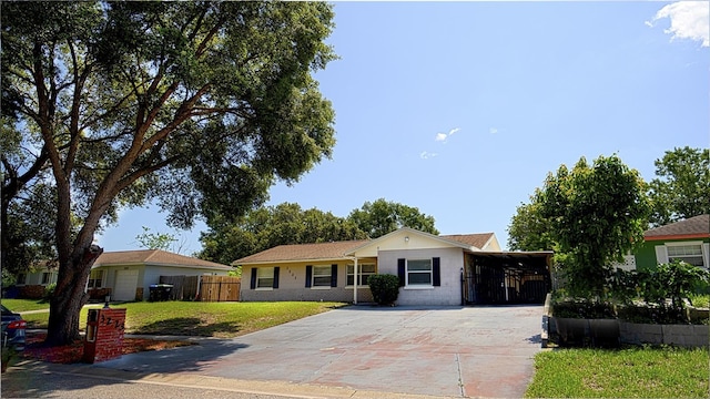 3223 Dragoon Pl, Orlando, FL 32818 - single story home with driveway and a carport