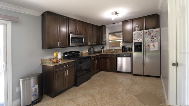 3223 Dragoon Pl, Orlando, FL 32818 - kitchen featuring stainless steel appliances, a sink, crown molding, dark brown cabinetry, and light stone countertops