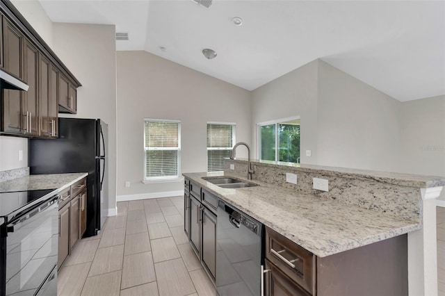 1206 Beechdale Ct, Deltona, FL 32725 - kitchen with dishwashing machine, a sink, electric range, a kitchen island with sink, and dark brown cabinets