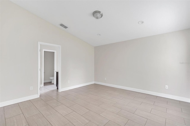1206 Beechdale Ct, Deltona, FL 32725 - spare room featuring lofted ceiling and baseboards