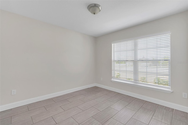 1206 Beechdale Ct, Deltona, FL 32725 - empty room featuring baseboards and wood tiled floors