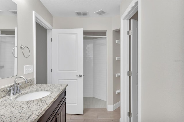1206 Beechdale Ct, Deltona, FL 32725 - full bathroom with vanity, tiled shower, and wood tiled floors