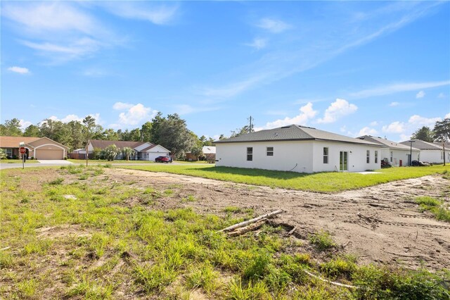 3749 SW 131st St, Ocala, FL 34473 - view of green lawn featuring driveway
