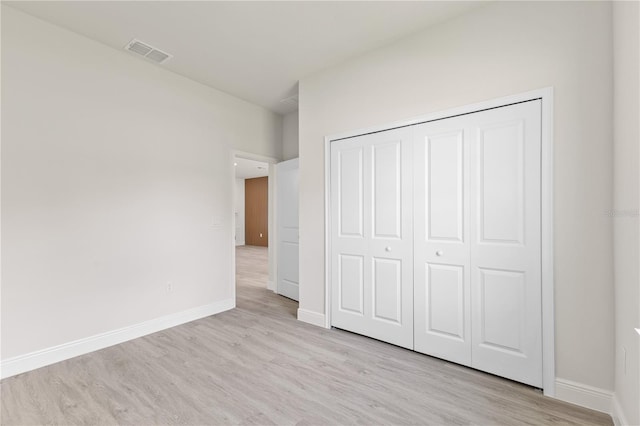 3749 SW 131st St, Ocala, FL 34473 - unfurnished bedroom featuring light wood-type flooring, baseboards, and a closet