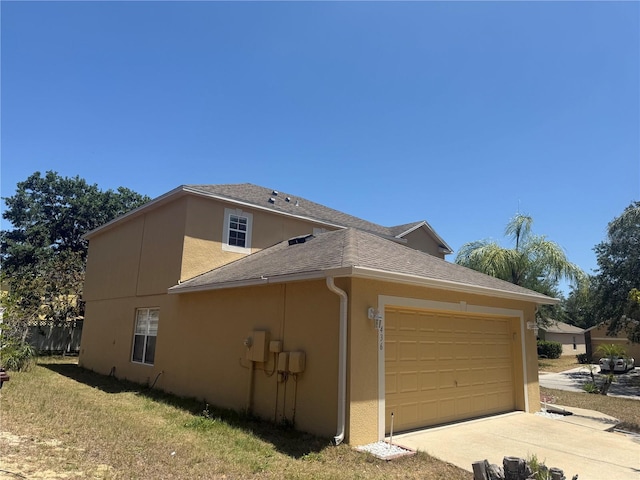 436 Hammerstone Ave, Haines City, FL 33844 - view of home's exterior with stucco siding, a garage, driveway, and roof with shingles