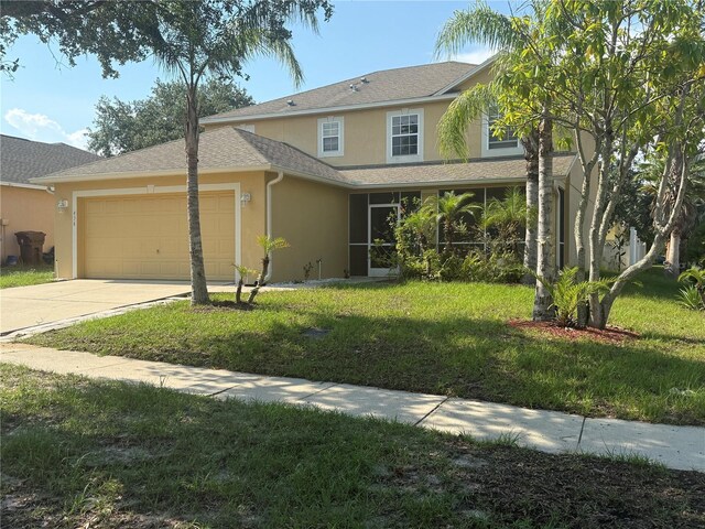 436 Hammerstone Ave, Haines City, FL 33844 - traditional-style home with stucco siding, a garage, a front lawn, and concrete driveway