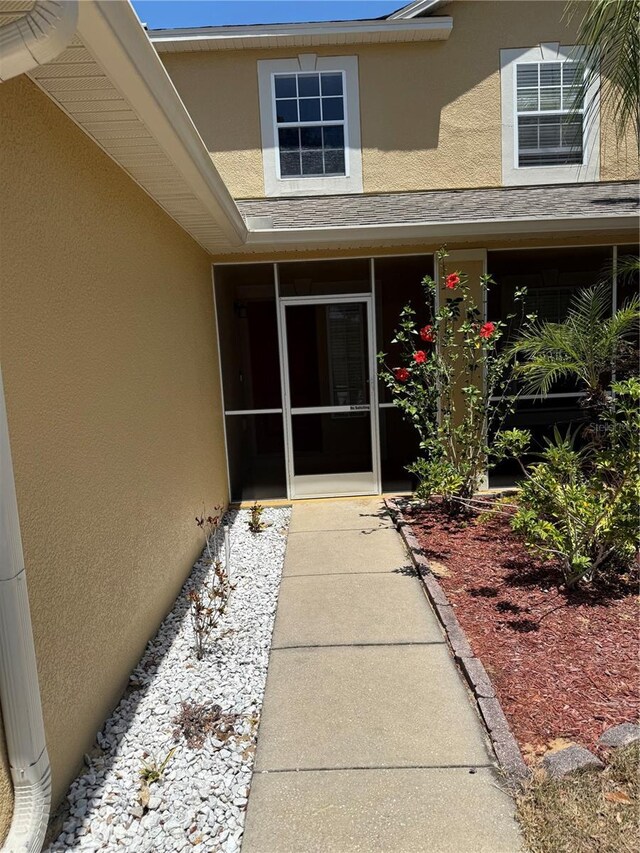 436 Hammerstone Ave, Haines City, FL 33844 - view of exterior entry featuring stucco siding