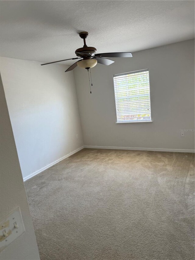 436 Hammerstone Ave, Haines City, FL 33844 - unfurnished room featuring a ceiling fan, carpet, baseboards, and a textured ceiling