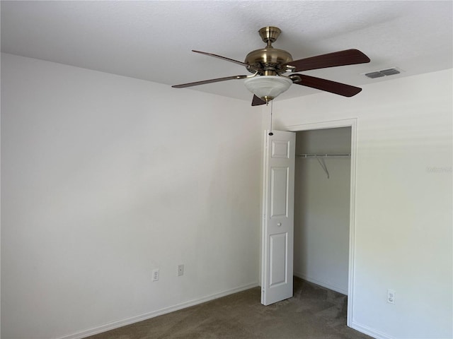 436 Hammerstone Ave, Haines City, FL 33844 - unfurnished bedroom with carpet, baseboards, a closet, and a ceiling fan