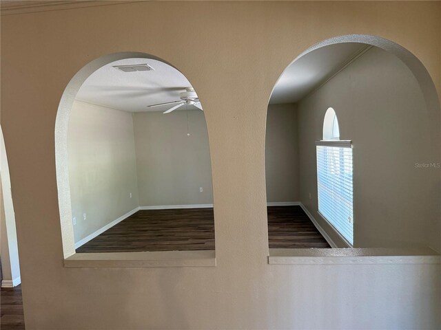 436 Hammerstone Ave, Haines City, FL 33844 - unfurnished room with wood finished floors, ceiling fan, and arched walkways