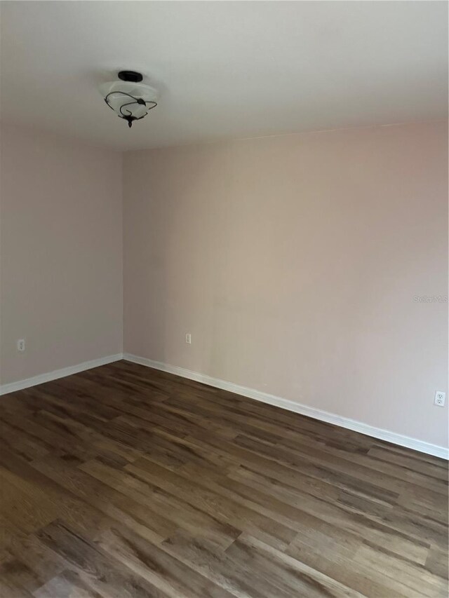 436 Hammerstone Ave, Haines City, FL 33844 - empty room featuring wood finished floors and baseboards