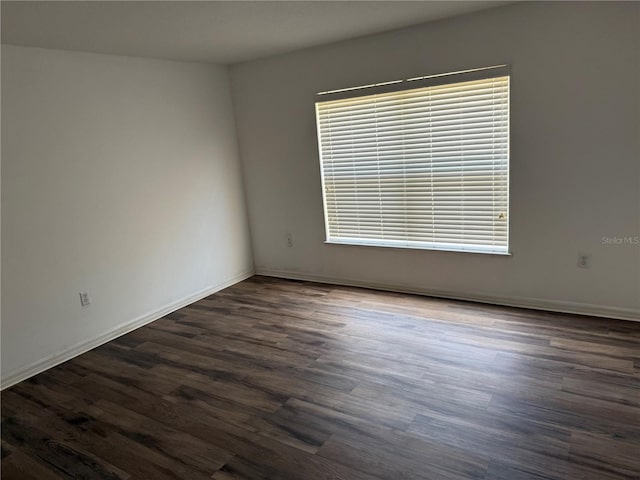 436 Hammerstone Ave, Haines City, FL 33844 - empty room featuring dark wood-style floors and baseboards