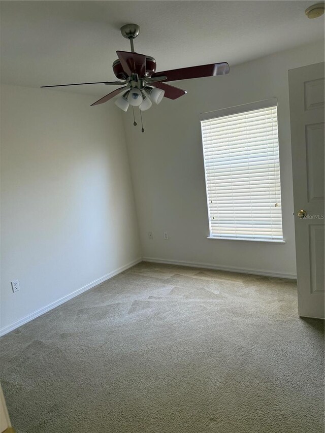 436 Hammerstone Ave, Haines City, FL 33844 - empty room featuring carpet floors, ceiling fan, a smoke detector, and baseboards