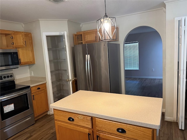 436 Hammerstone Ave, Haines City, FL 33844 - kitchen with appliances with stainless steel finishes, arched walkways, crown molding, dark wood-style flooring, and light countertops