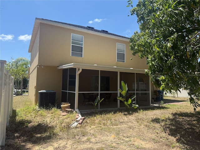 436 Hammerstone Ave, Haines City, FL 33844 - rear view of property featuring cooling unit, a sunroom, and stucco siding
